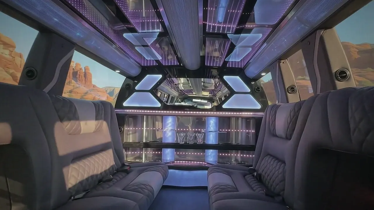 Inside the Cadillac Escalade limo in Timnath: LED light-show ceiling, leather lounge seating and lit bar